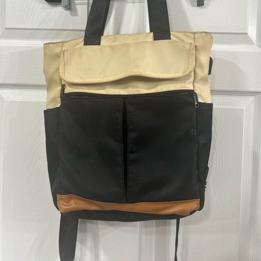 Stylish Black and Tan Backpack Bag with charging outlet.